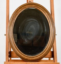 Cornice ovale dorata con